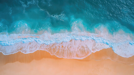 Fototapeta premium Aerial beach view waves crashing onto golden sand. Ocean colors transition