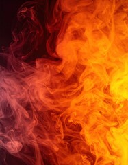 Fototapeta premium A vibrant swirl of red and yellow smoke gracefully dances against a deep black background, creating a striking contrast that captivates the eye.