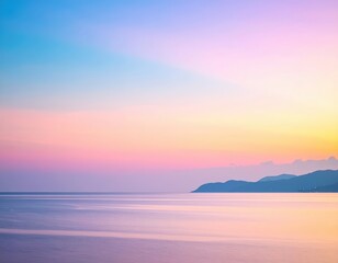 Obraz premium A breathtaking sunset casts vibrant hues of orange and pink across the ocean, with majestic mountains silhouetted against the colorful sky.