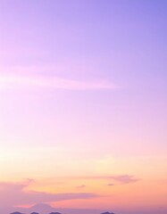 Obraz premium A breathtaking sunset casts vibrant hues of orange and pink across the ocean, reflecting on the water's surface, with majestic mountains silhouetted in the background.