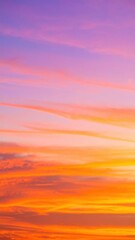 Fototapeta premium A breathtaking sunset paints the sky with vibrant hues of orange, pink, and purple, as fluffy clouds drift lazily across the horizon, framing the sun's descent.