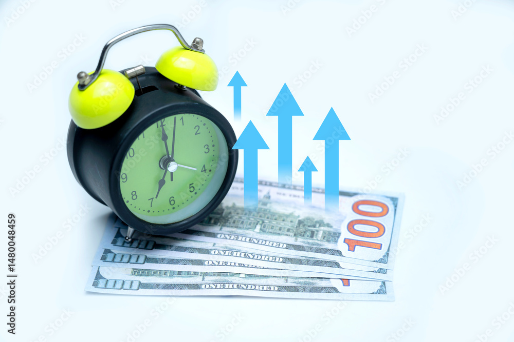 Poster green alarm clock and a pile of 100 dollar banknotes with an upward chart arrow on a white backgroun