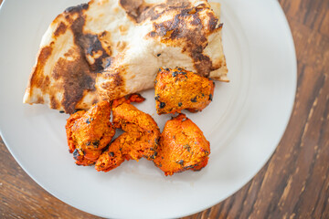 Spicy Chicken Tikka served butter naan bread
