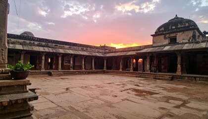 Fototapeta premium Serene Sunset Over Ancient Temple Courtyard with Stunning Architecture