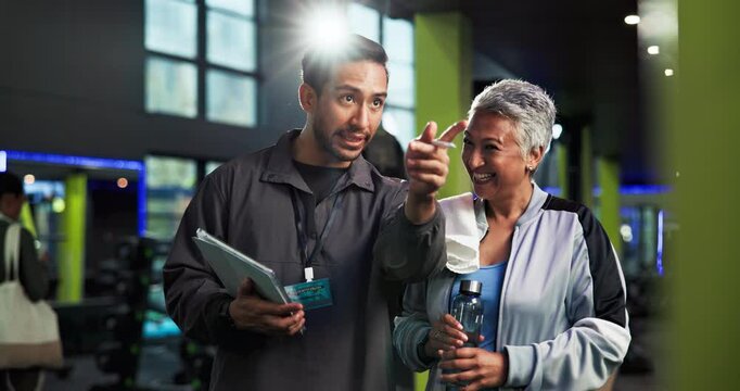 High five, old woman and personal trainer with tablet at gym for membership sign up, digital contract and welcome. Laughing, instructor and support for fitness subscription and join retirement club