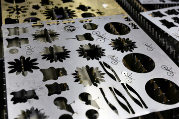 Various shape metal perforated steel made from automatic and high precision laser cutting process in industrial at factory.