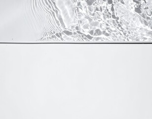 A serene water surface glistens under soft sunlight, showcasing gentle ripples that create mesmerizing patterns, reflecting the surrounding nature.