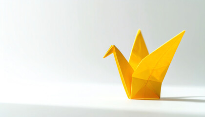 A bright yellow origami crane stands gracefully against a soft, neutral background, showcasing the art of paper folding and creativity