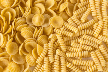 Pasta. Various kinds of uncooked pasta , top view , high-resolution . Pasta background , flat lay .