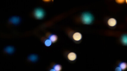 Abstract defocused blurred bokeh light dots background. Blurred holiday celebration lights.