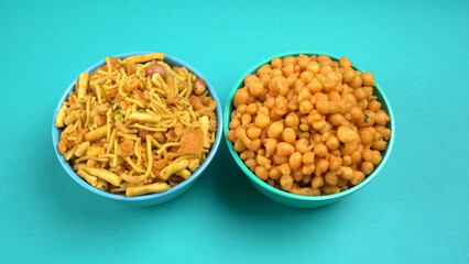 Indian Snacks, Traditional Indian deep fried salty dish called chivda or mixture or farsan made of gram flour and mixed with dry fruits and roasted nuts with salt, pepper, pulses, spice and green peas