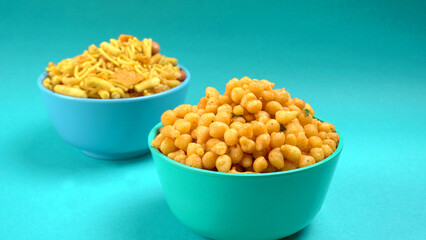 Indian Snacks, Traditional Indian deep fried salty dish called chivda or mixture or farsan made of gram flour and mixed with dry fruits and roasted nuts with salt, pepper, pulses, spice and green peas