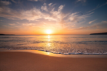 Beautiful sunrise over the sea shore and ocean waves