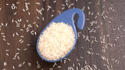 Healthy food. Wooden bowl with parboiled rice on white background. Top view, copy space, high...