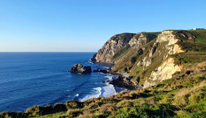 Fototapeta premium Dramatic Coastal Landscape with Rocky Cliffs and Deep Blue Ocean