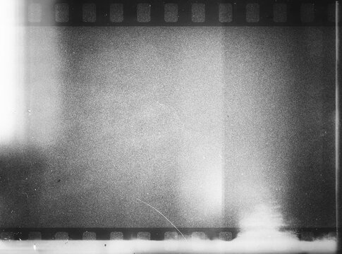 80's negative photo film with grain scratches dust, film grain  photo overlay background, light leaks texture effect. Grainy negative photo film textures