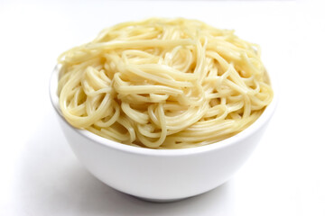 a bowl of plain spaghetti isolated on a white background