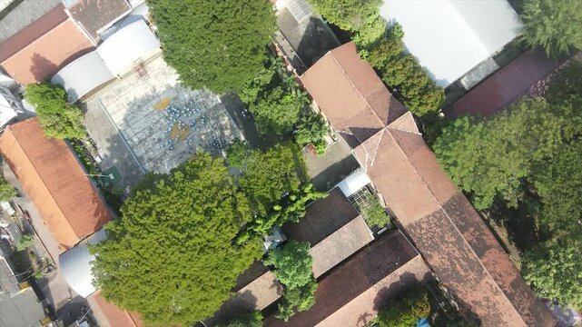 Aerial view of junior high school students forming letter patterns on school field