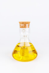 Glass bottle of olive oil standing alone on clean white background, ideal for cooking and nutrition related concepts.Descripción: