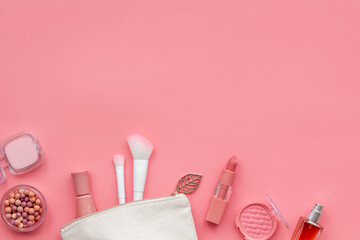Layout of cosmetic bag with makeup brown pink shade beauty products, top view