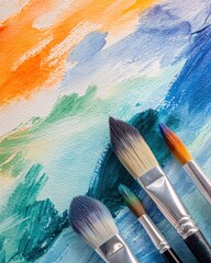 Obraz premium Artistic Paintbrushes on Watercolor Painting Background Close Up Top View Arts and Crafts Creative Expression Illustration Texture Abstract