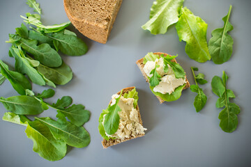 Close-up of a sandwich with herring and salad leaves