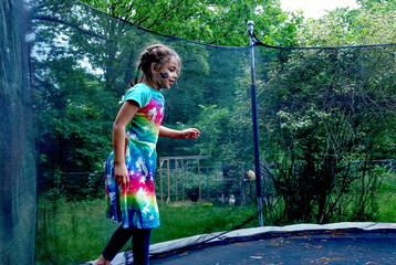Girl inside a netted trampoline