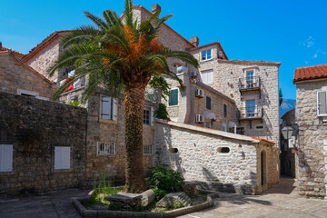 Narrow paved street in the Old Town of Budva, a walled coastal city built by the Venetian Republic along the coast of the Adriatic Sea in Montenegro