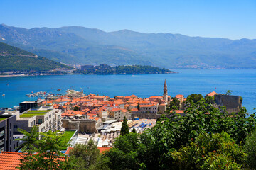 Obraz premium Aerial view of Budva Old Town, a famous resort town on the Montenegrin Riviera along the coast of the Adriatic Sea