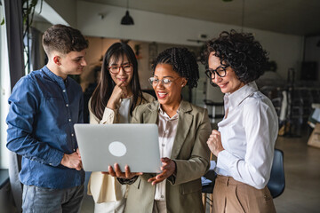multicultural business people work on project together in office