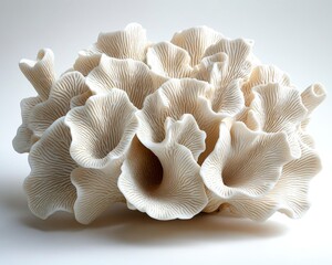 Intricate white coral sculpture showcasing detailed textures and patterns, ideal for artistic decor