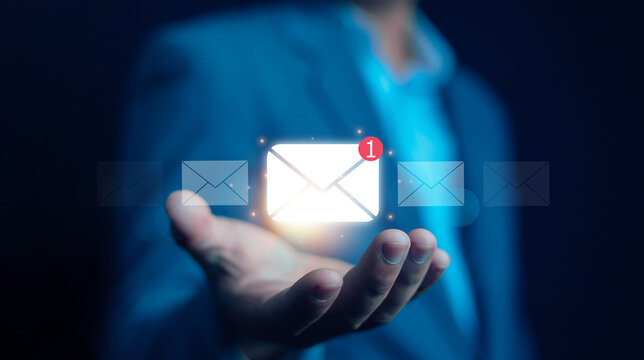 New email notification concept, business online communication, email communication, digital marketing, businessman responding to floating digital interface showing new email notification symbol.	 - Powered by Adobe