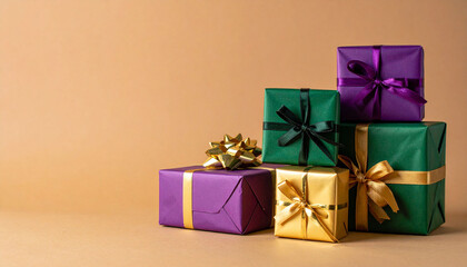 centered against a tan backdrop, a collection of cube shaped packages stacked to form a short pyramid creates a festive scene