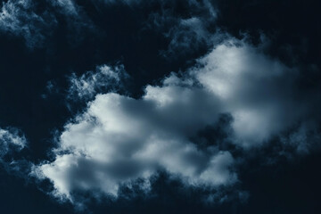 Fototapeta premium A dramatic sky filled with dark, ominous clouds creating a moody atmosphere scene