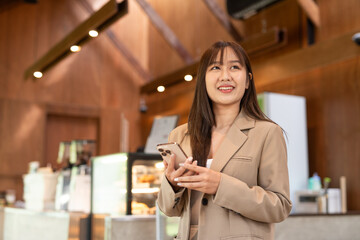 young woman in cafe using phone