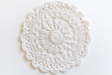 White crochet doily isolated on white background for table decoration, crafts, and vintage design.