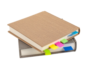 Two hardcover books with colorful sticky tabs inserted along the edges.