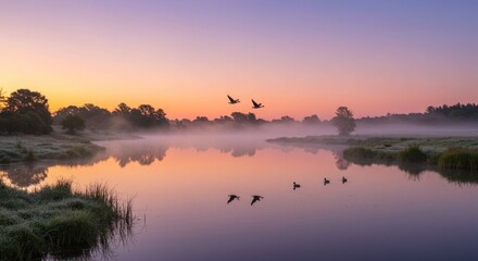 Misty sunrise over lake. Photo.