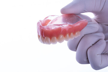 Upper complete denture in white background