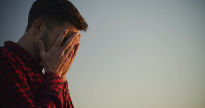 Close-Up of Sad Man Against Blue Sky