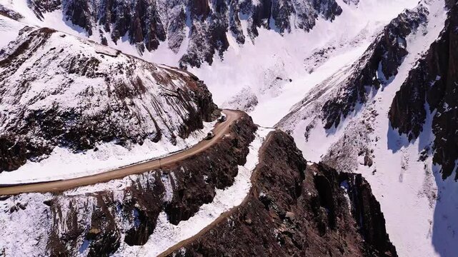 Snow-covered road winding through Zoji LaMountain pass Himalayan high mountain pass in the Kargil district of the Union Territory of Ladakh, India