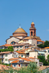 Fototapeta premium Madonna del Soccorso Church dominating the skyline of Castiglione del Lago, Italy