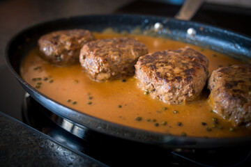 meat balls with pepper sauce roasted in a pan