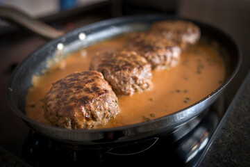 meat balls with pepper sauce roasted in a pan