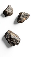 Three rough, natural stones with distinct textures against a clean white background.