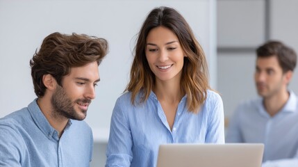 Fototapeta premium People Collaborating on Laptop in Office Setting