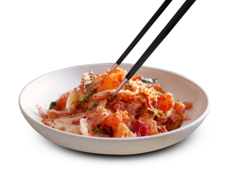 Traditional Korean kimchi cabbage with chopsticks in a ceramic bowl, isolated on transparent background, showcasing spicy fermented food for healthy eating
