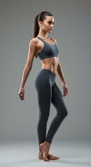Obraz premium Fit young woman in athletic wear posing in studio for fitness and health inspiration