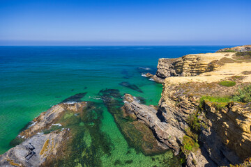 Breathtaking coastal landscape showing cliffs and turquoise waters in Odemira, Portugal