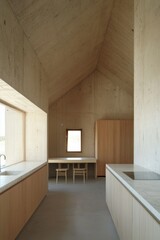 Minimalist kitchen interior in concrete house with wooden cabinets and marble countertops bright daylight architectural photography